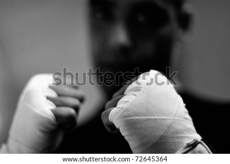 stock-photo-boxer-s-bandaged-hands-is-72645364.jpg